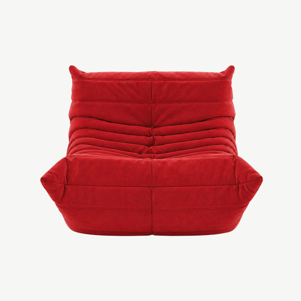 LUMA Mini low lounge chair in Carmine – studio view